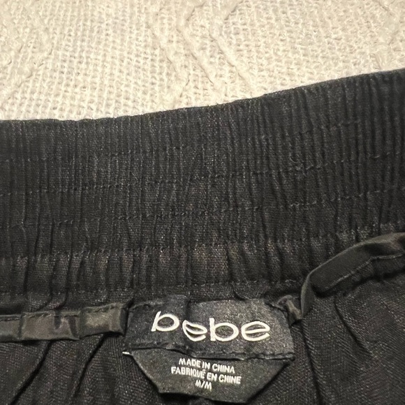 #1056. Bebe Black Flair Cargo Shorts with Button and Pocket Details. Size M - Picture 4 of 8